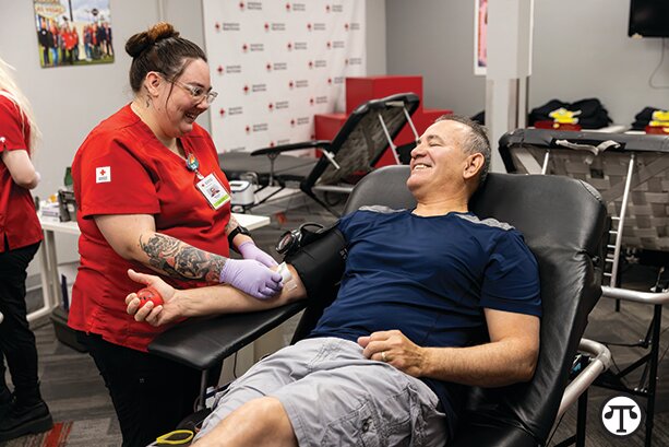 Raul Coello donates blood with assistance from Red Cross phlebotomist McKenzie Peters. Volunteer blood donors are essential to maintaining a stable blood supply for patients facing emergencies, surgeries and ongoing medical treatments.