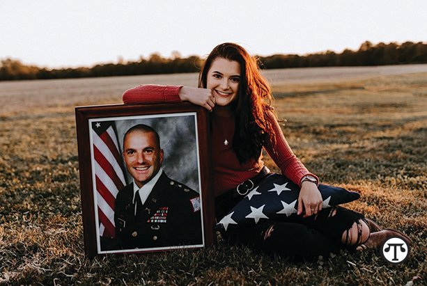 Ashley, a junior at Eastern Illinois University, poses with a photo of her father, who was killed in action in Iraq in 2009. Ashley continues to receive educational scholarships from Children of Fallen Patriots.